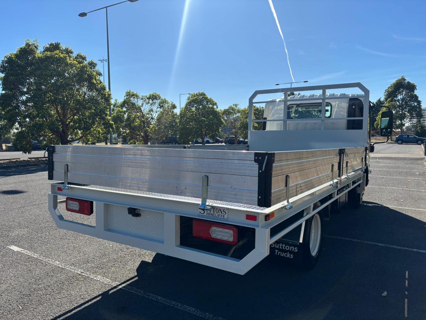 2025 Isuzu N Series NNR 45-150 DT D34 Steel Tray with Aluminium Dropsides image 6